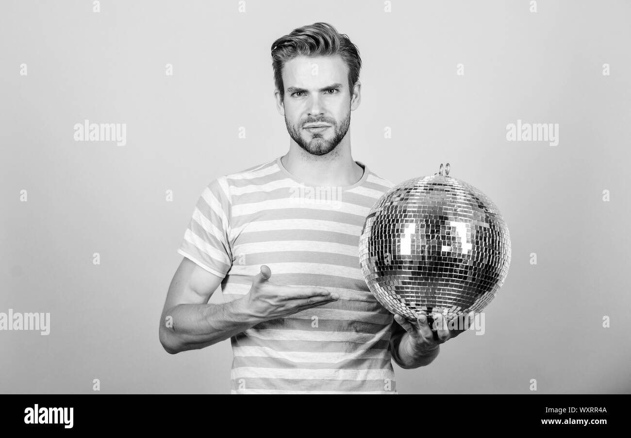 Cheerful dj man. How about party. Handsome man hold disco ball