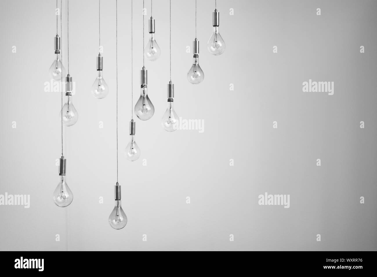 Conceptual luminaire with several hanging retro lamps Stock Photo