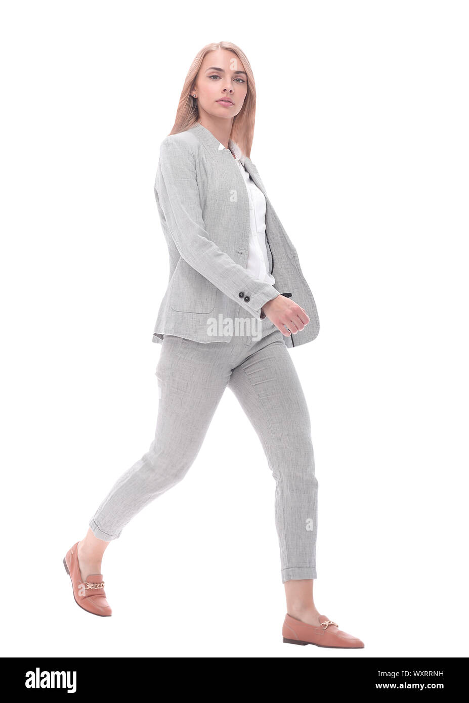 serious young businesswoman stepping forward.isolated on white Stock ...