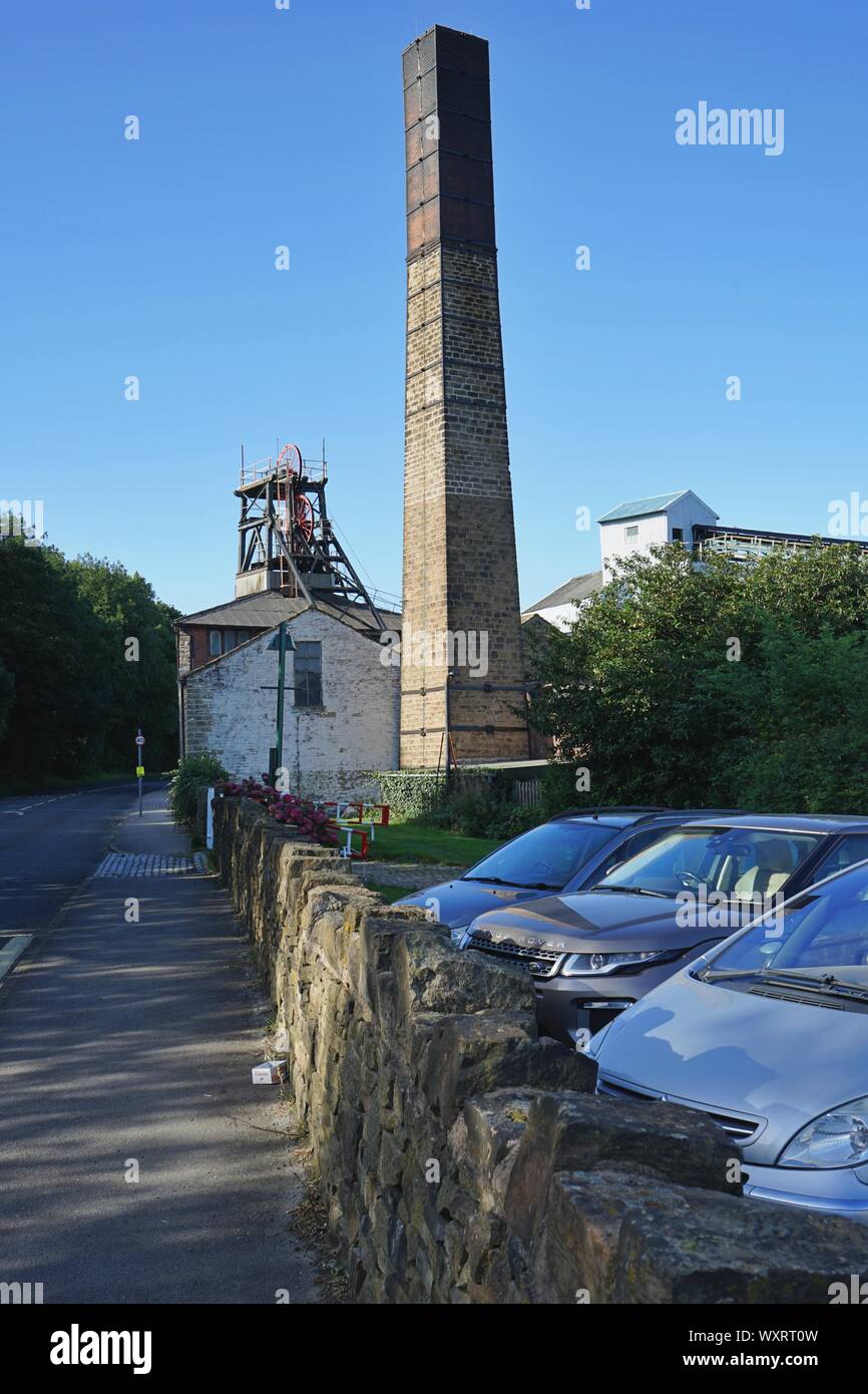 The chimney winding head and building at the national coal minning museum for england Kellingley Wakefield Yorkshire England Stock Photo