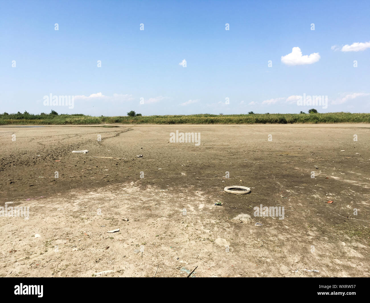 Dried river. Countryside. Garbage lies on the river bank. Summer ...