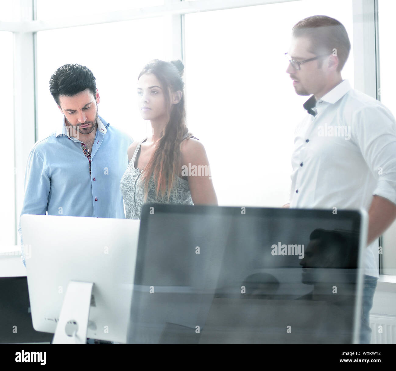 business team standing in new office Stock Photo - Alamy