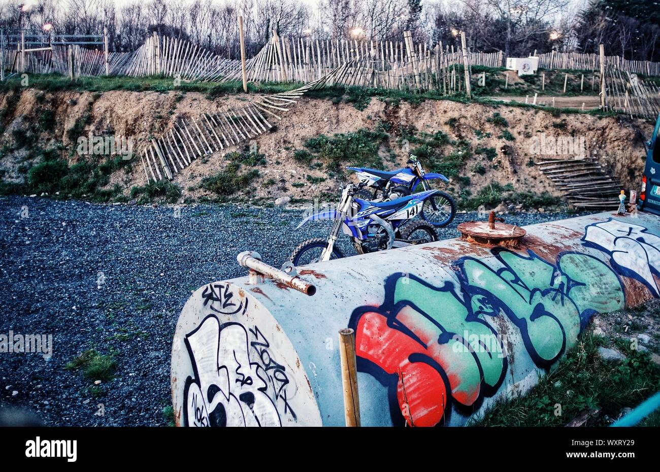 Two scramblers stand in a gritty landscape Stock Photo