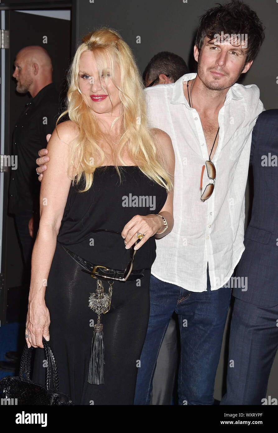 BEVERLY HILLS, CA - SEPTEMBER 16: Nicollette Sheridan (L) and Jake Marcus attend the Premiere Of Quiver Distribution's 'Running With The Devil' at Writers Guild Theater on September 16, 2019 in Beverly Hills, California. Stock Photo