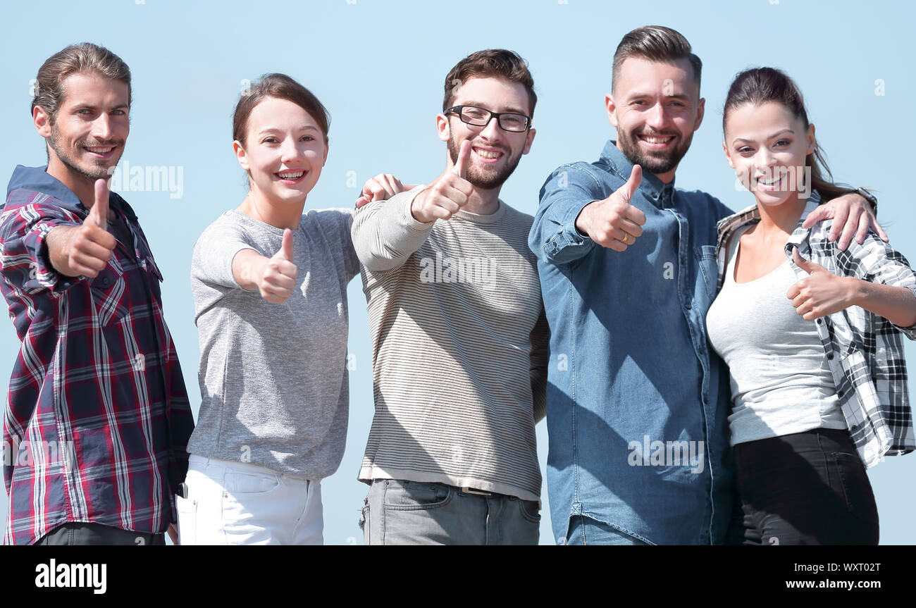 group of young people showing thumb up Stock Photo - Alamy