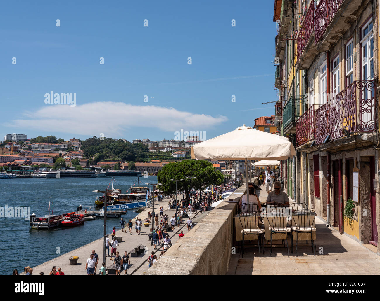 Small sidewalk cafe alongside Bairro da Ribeira Stock Photo - Alamy