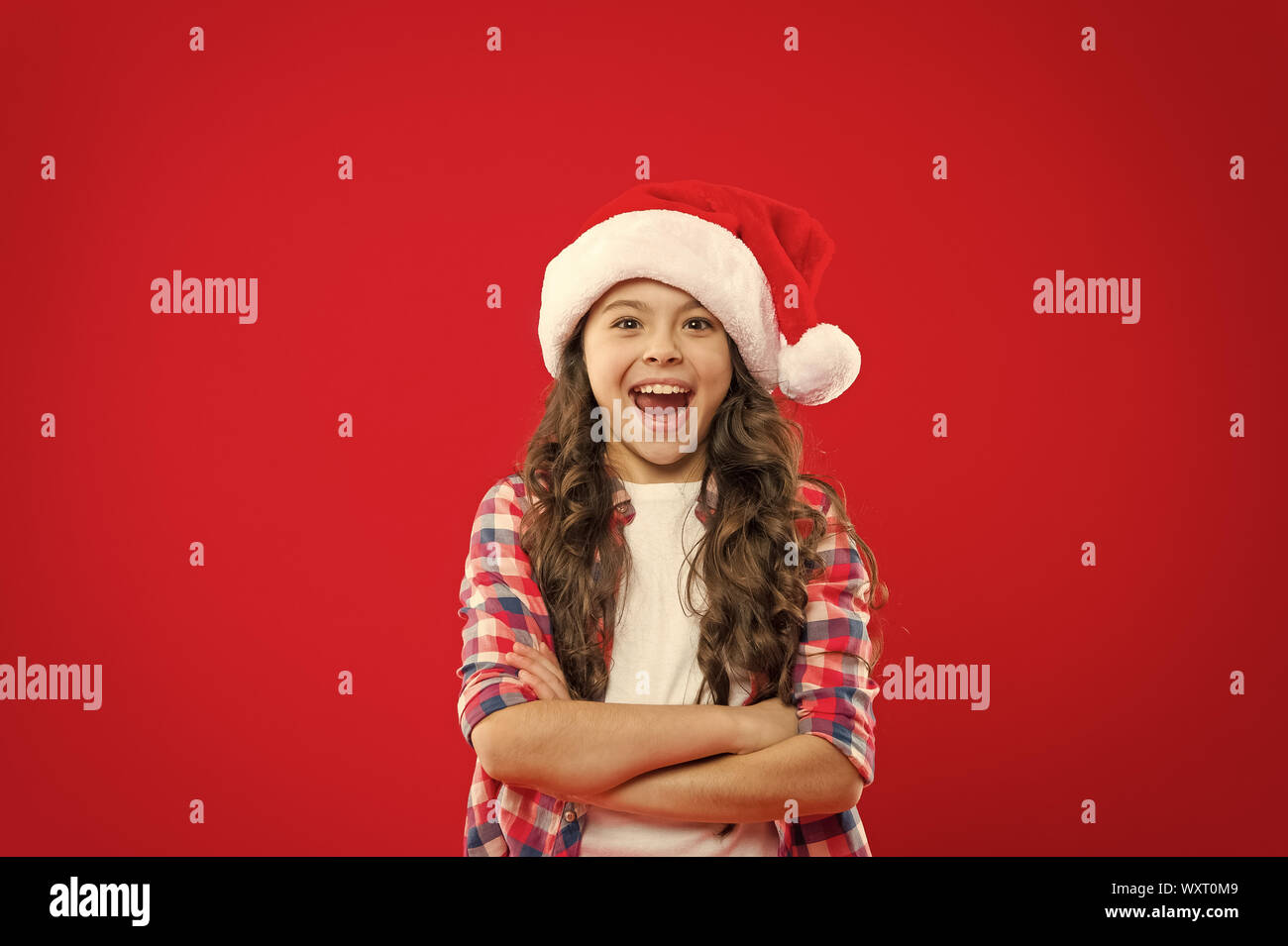 Cheers. Little girl child in santa red hat. Christmas shopping. Present ...