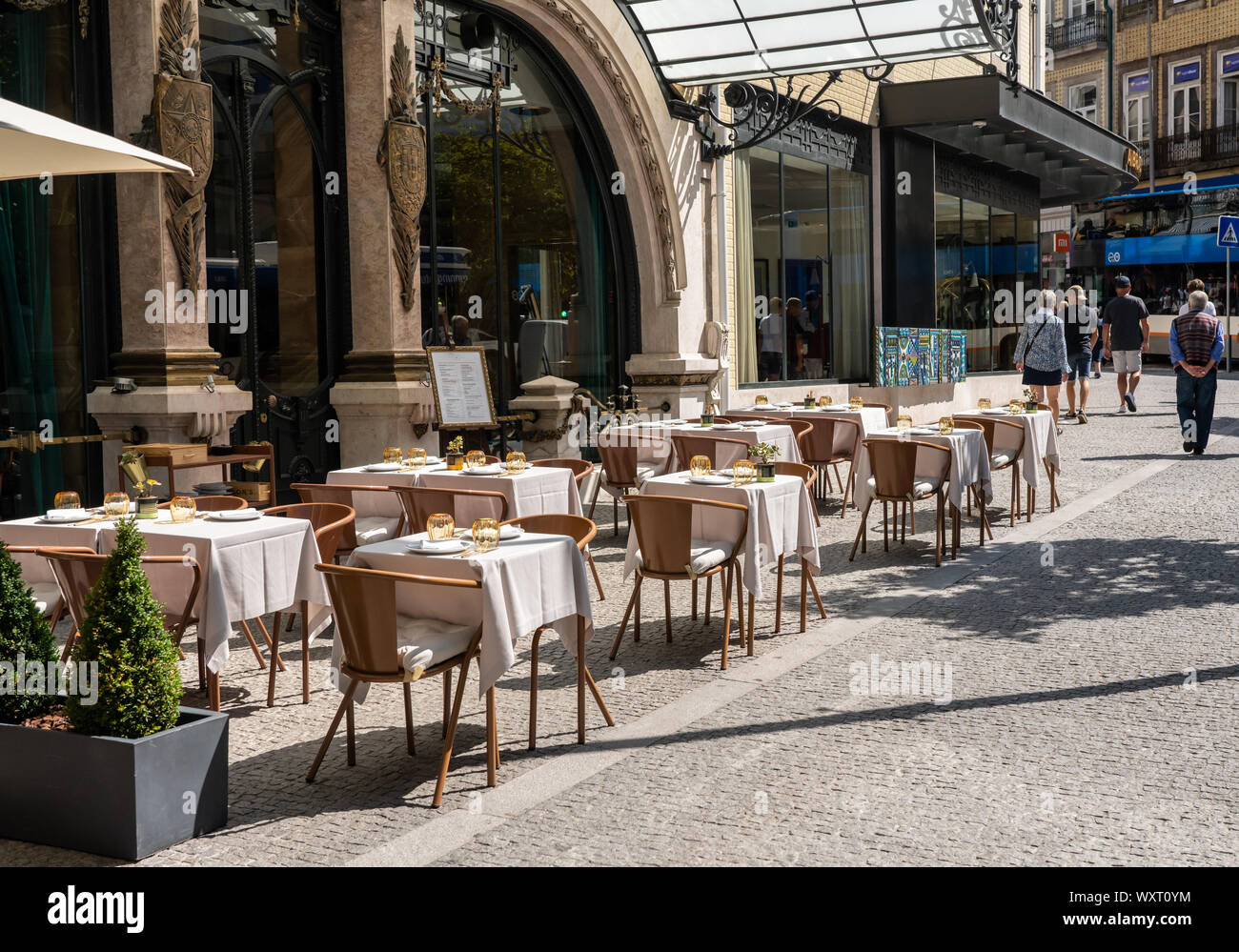 Tables set for lunch outside the Brazilian Restaurant in Porto Stock Photo