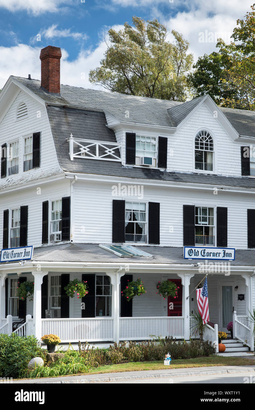 Wooden clapboard Old Corner Inn with patriotic Stars and Stripes flag at ManchesterbytheSea