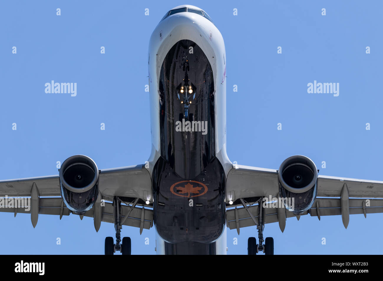 Air Canada logo on the bottom of an aircraft while landing at Vancouver Intl. Airport. Stock Photo