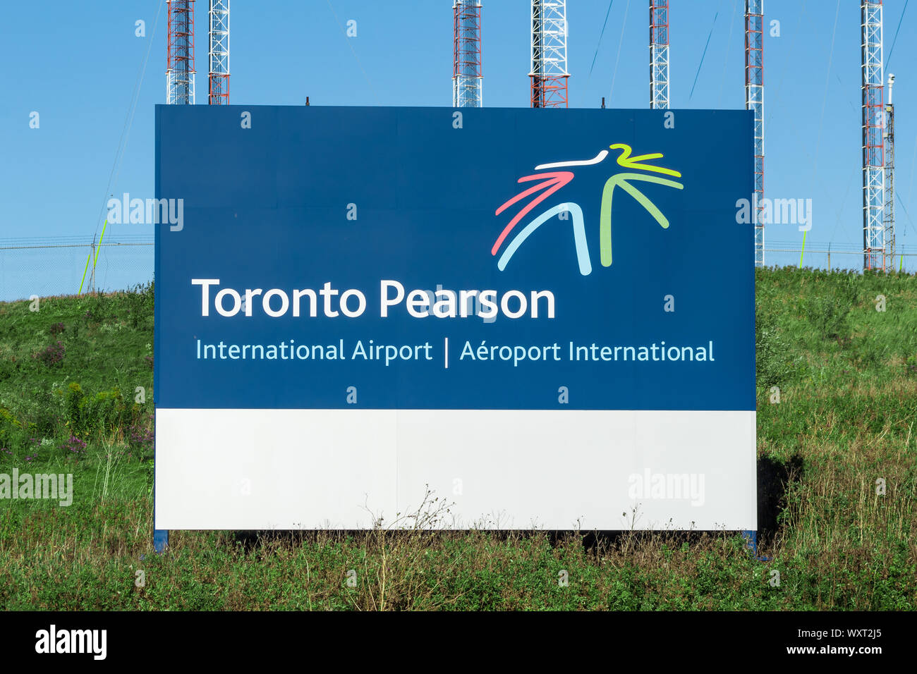 Toronto Pearson International Airport sign on a grass hill outside the airport. Stock Photo