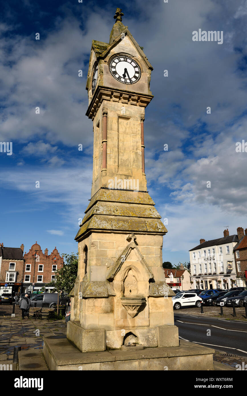 Evening light on Clock tower of Cotswold limestone in the Town Centre of Thirsk Market town North Yorkshire England Stock Photo
