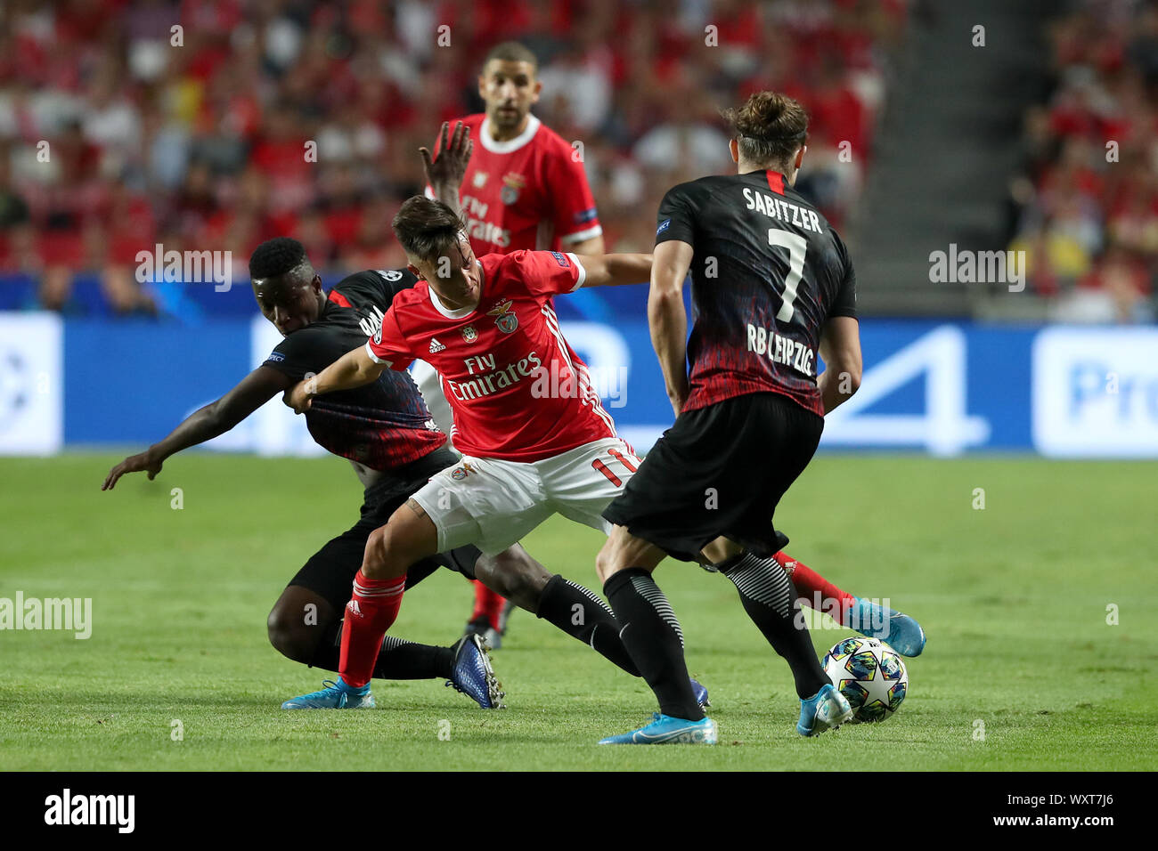 Lisbon. 17th Sep, 2019. Franco Cervi (front C) of SL Benfica vies with Nordi Mukiele (L) and Marcel Sabitzer of RB Leipzig during the UEFA Champions League Group G football match in Lisbon, Portugal on Sept. 17, 2019. Credit: Pedro Fiuza/Xinhua Stock Photo