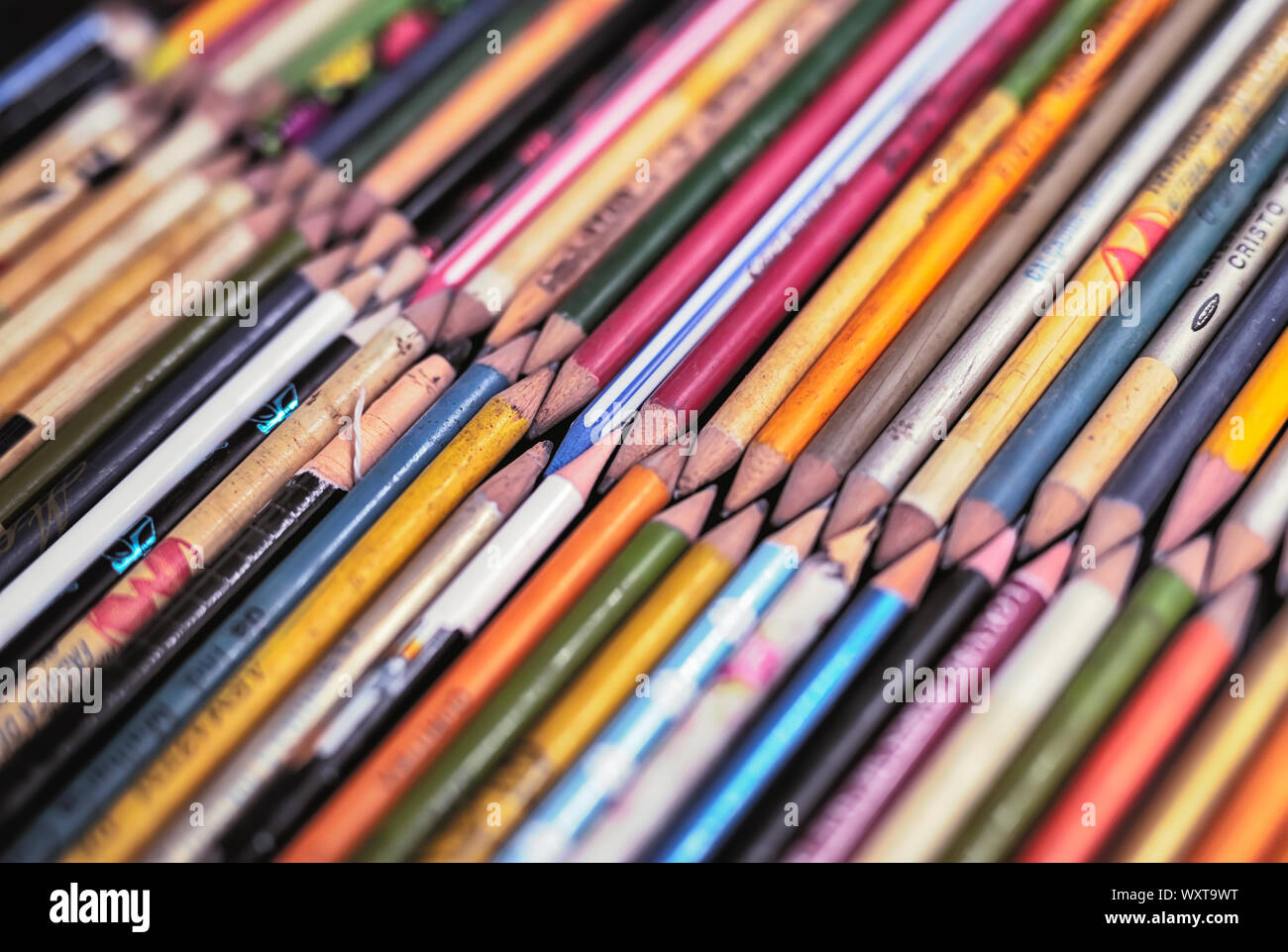 Photo of several old pencils, collection of pencils that no longer exist. Depth of field. Stock Photo