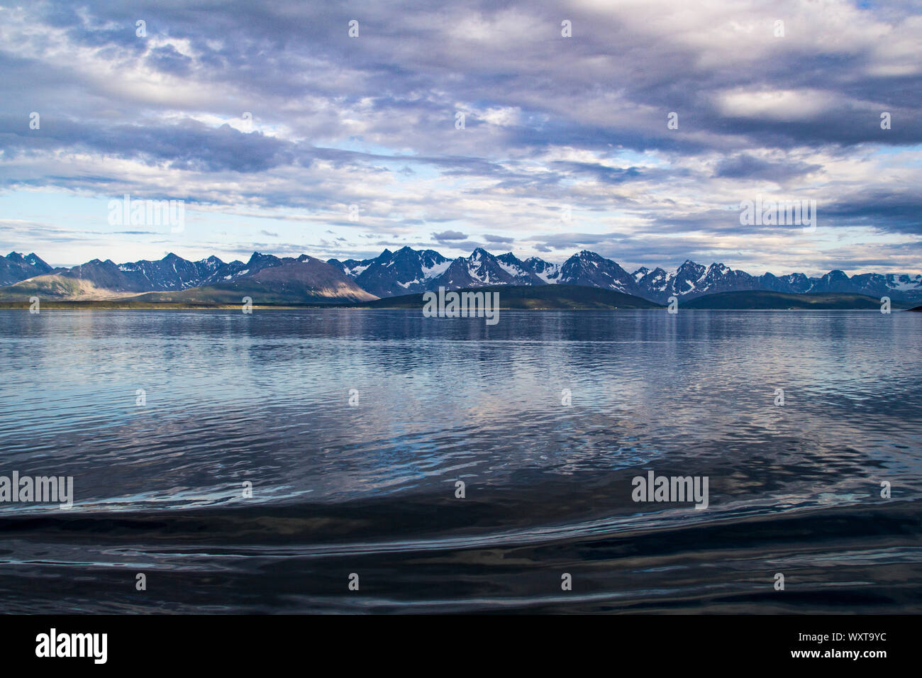 Glorious scenery within the Norwegian Fjords with snow on the mountains even in summer Stock Photo