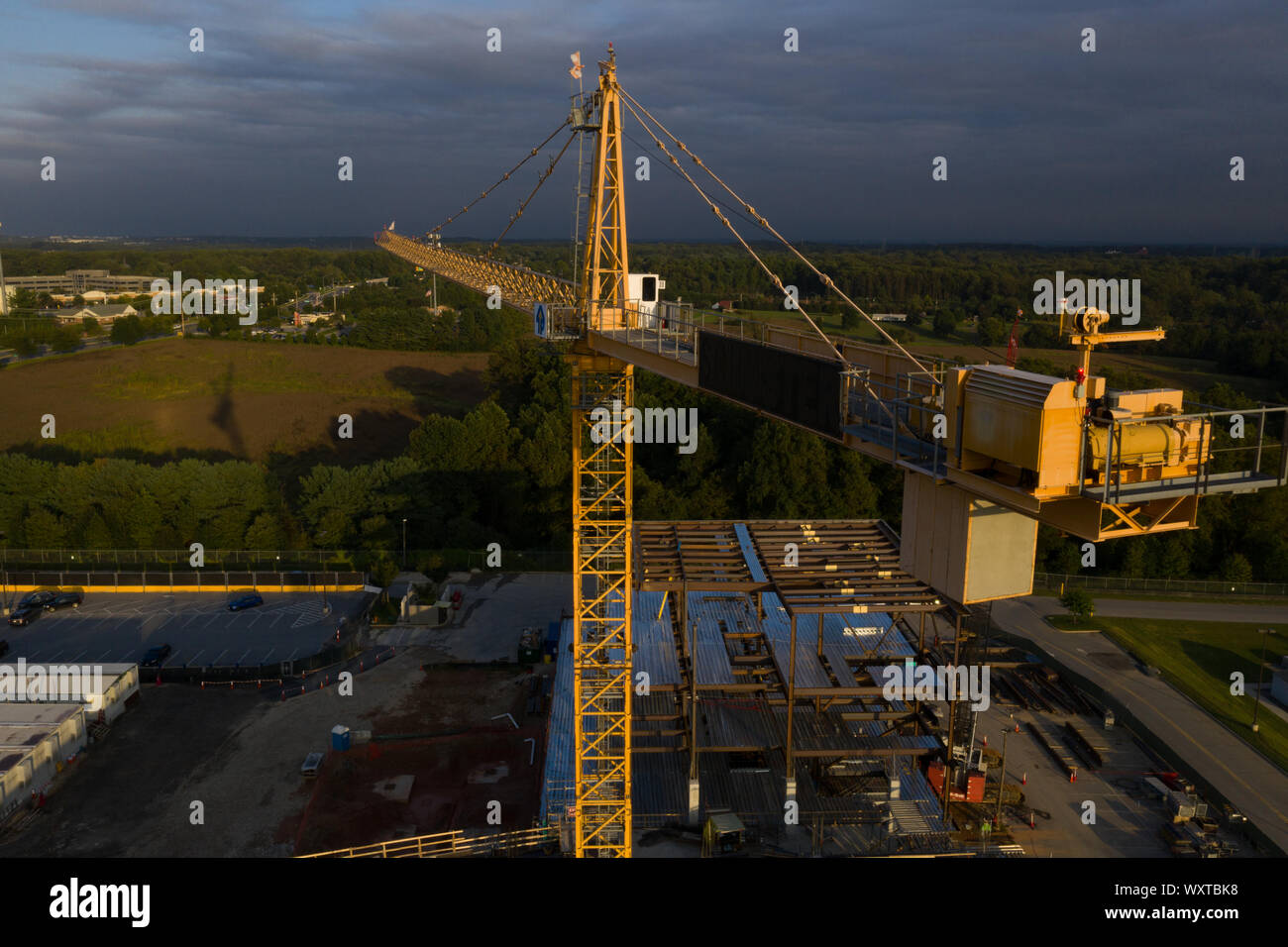 Aerial view of American construction building site with yellow crane ...