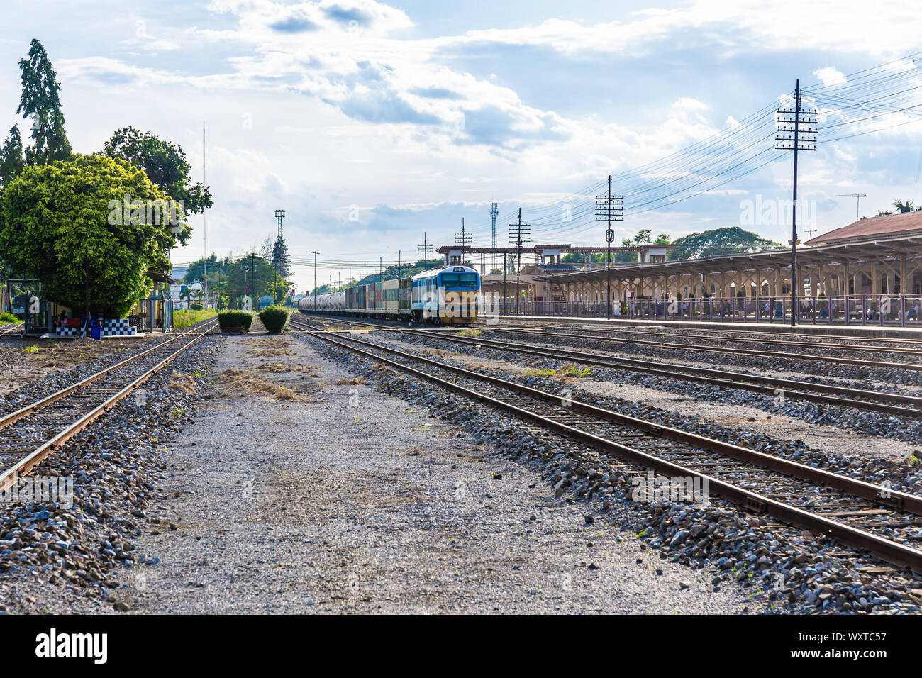 Cargo train platform with container in countryside Thailand. Stock Photo