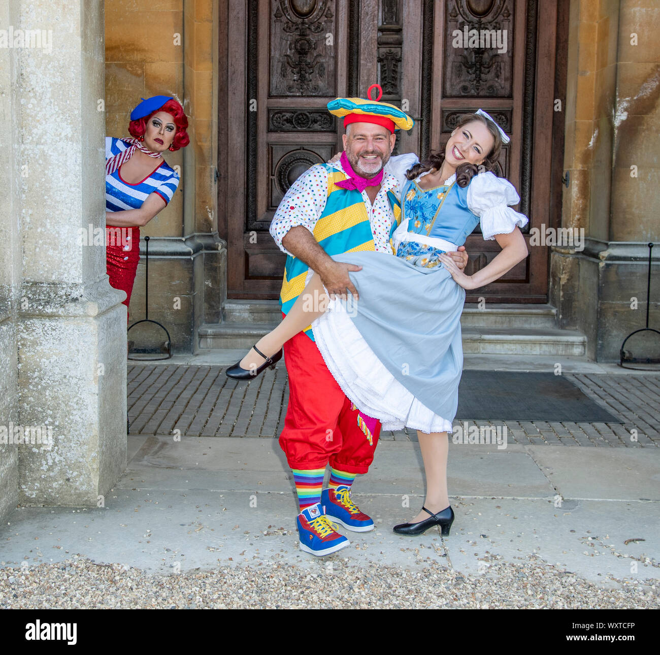 (L-R) La Voix (Polly Pot et Pan), Andy Collins (Louis Pot et Pan) and Amelia Adams-Pearce (Belle) attend the Beauty & The Beast pantomime press launch at Waddesdon Manor, Aylesbury. Stock Photo