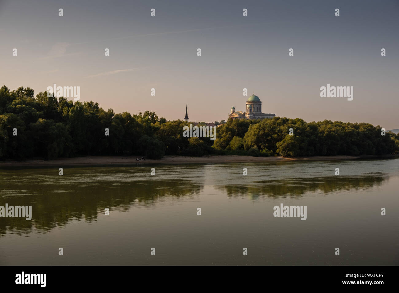 ESZTERGOM, HUNGARY - AUGUST 20, 2019: Esztergom Cathedral view from the Danube river at sunrise Stock Photo