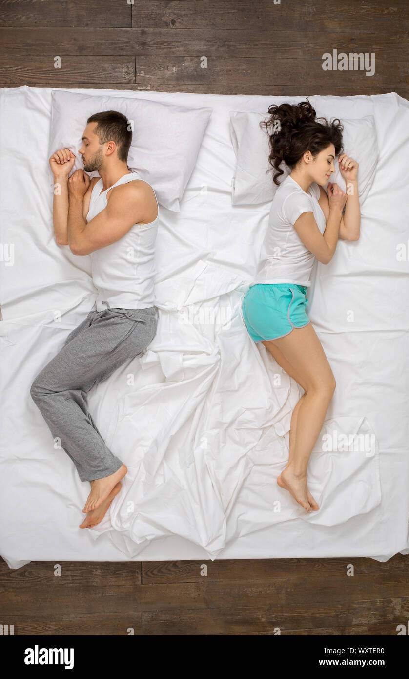 Young couple relaxation on the bed top view dreaming Stock Photo