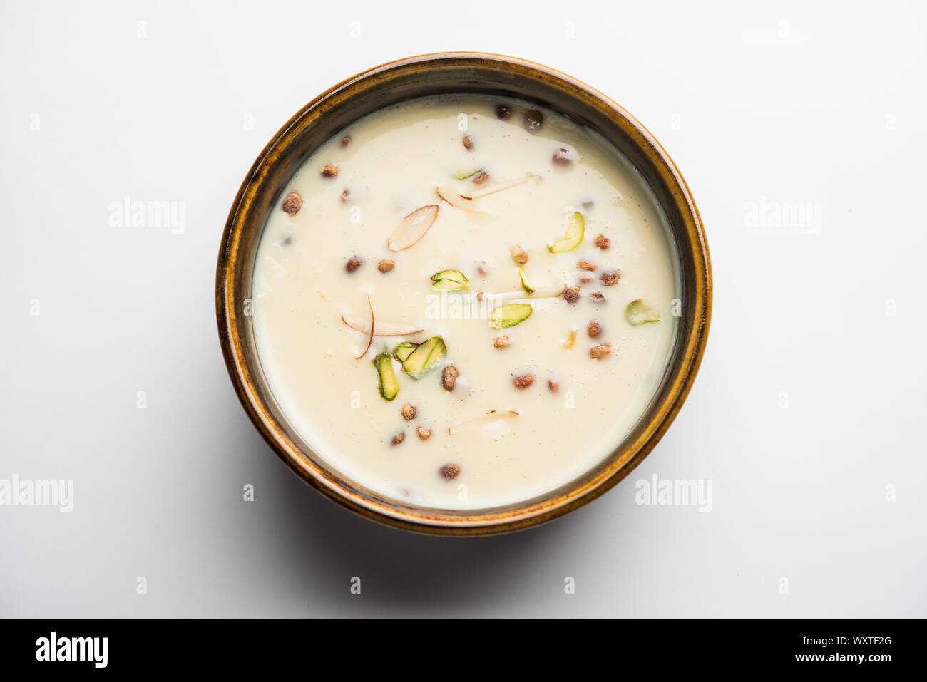 Fruit Rabedi Basundi / Rabri or Rabdi - is a dessert made of condensed milk and dry ...