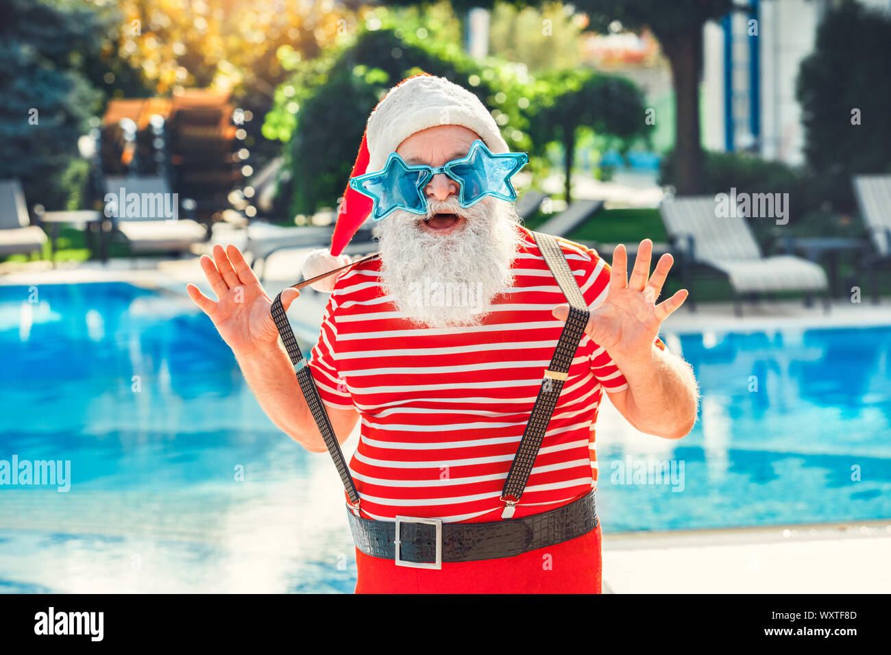 Santa Claus near the pool holiday vacation concept Stock Photo