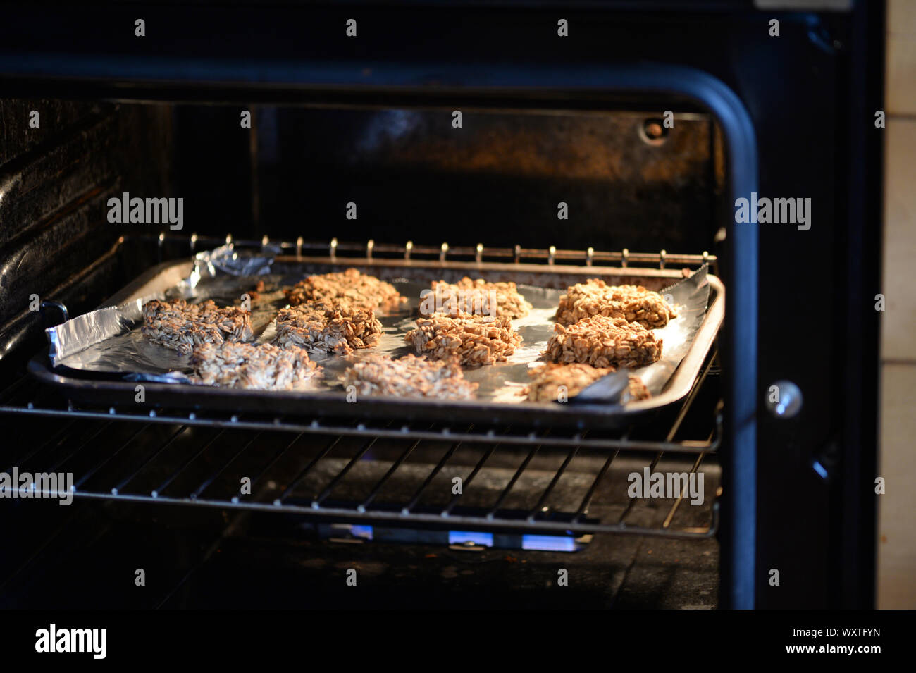 Oat and banana cookies baking in the oven Stock Photo