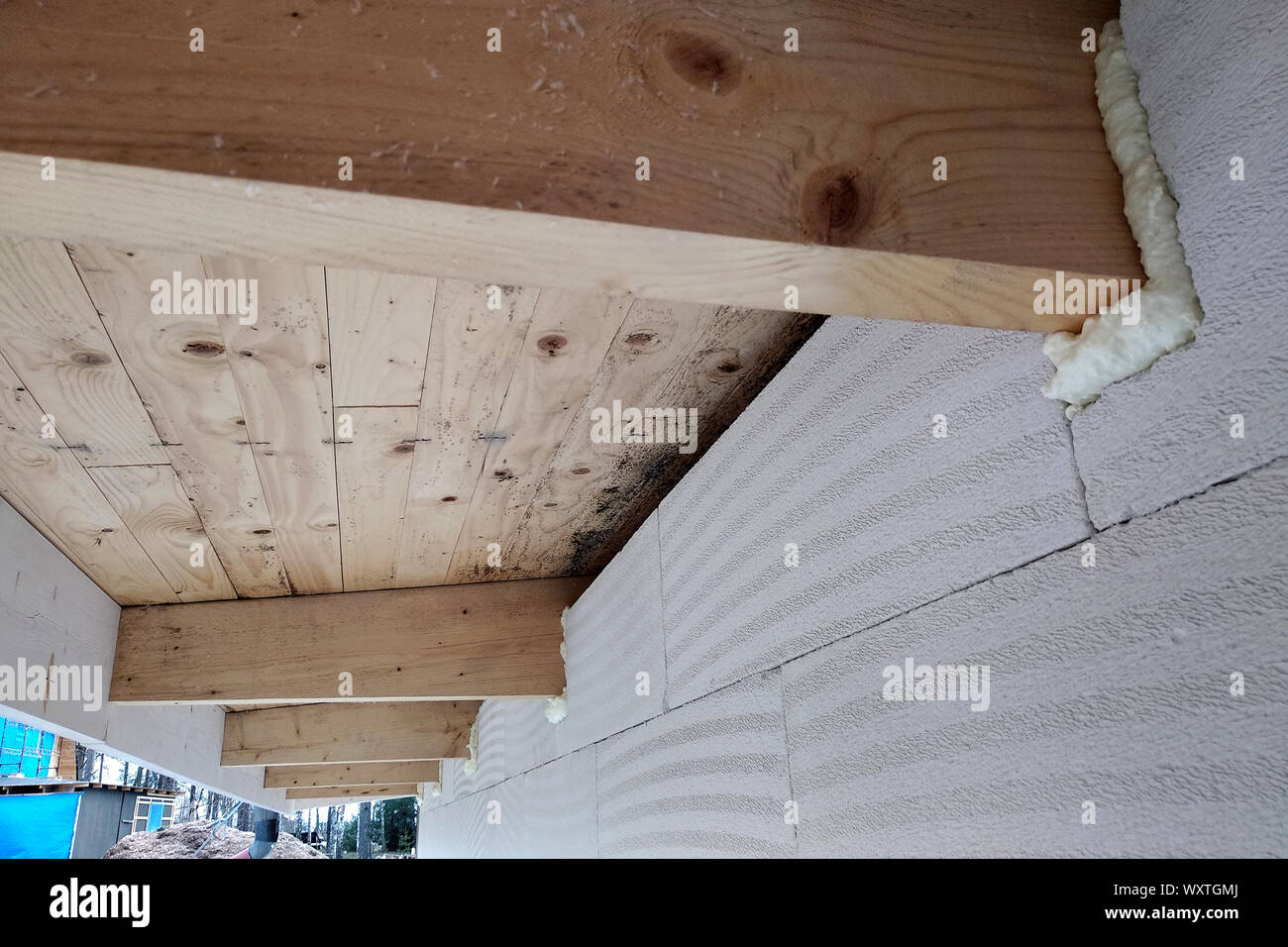 Installation Of Wooden Beams Of Roof Frame With Spray Foam