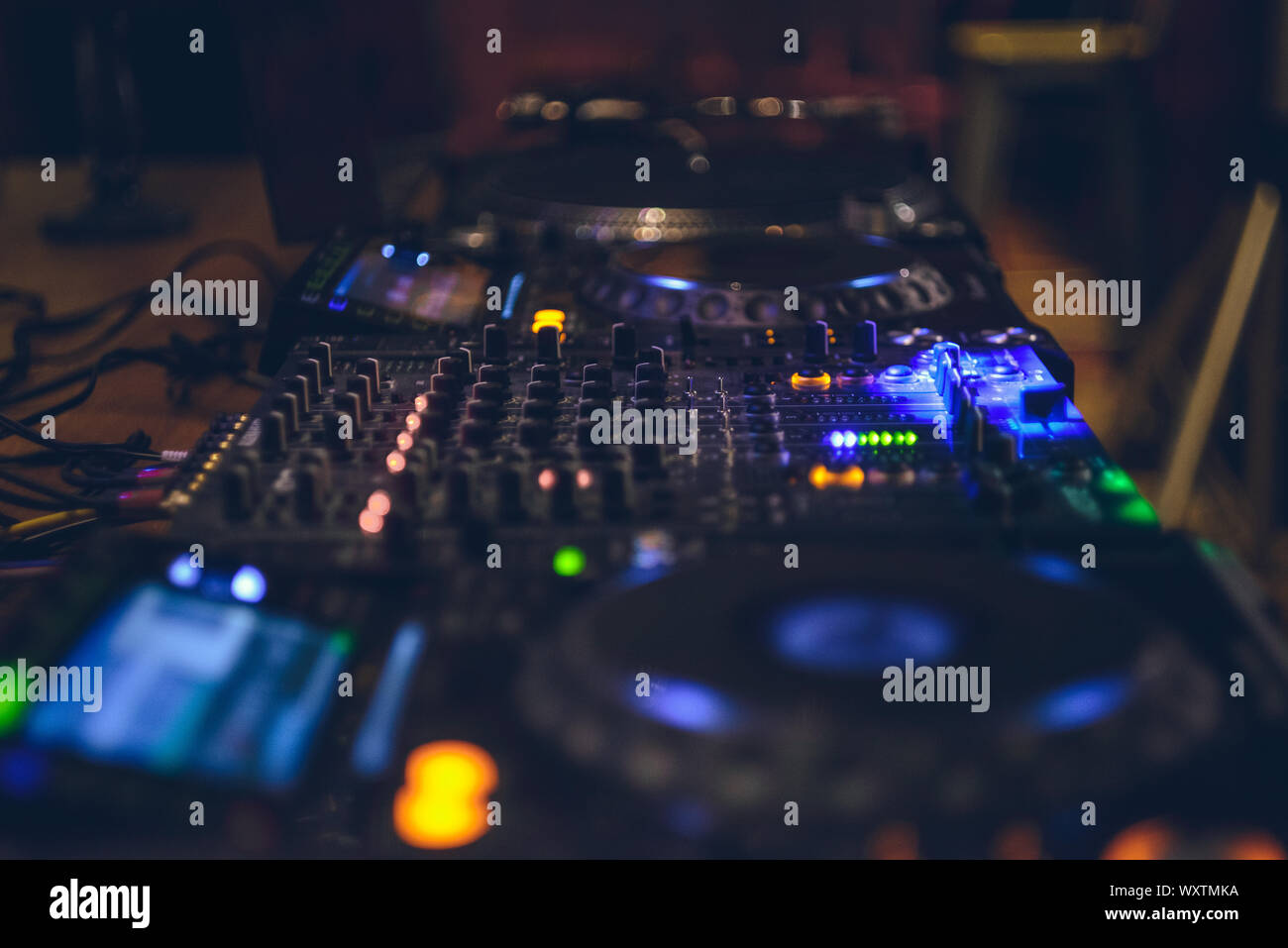 DJ CD player and mixer. DJ Spinning, Mixing, and Scratching in a Night