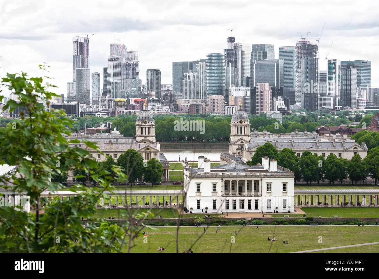 View from the Greenwich Royal Observatory, looking across Greenwich Park towards Canary Wharf and the River Thames, London, England, UK Stock Photo