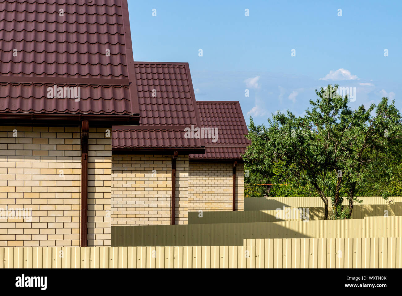 view on a row of a new modern residential house complex Stock Photo - Alamy