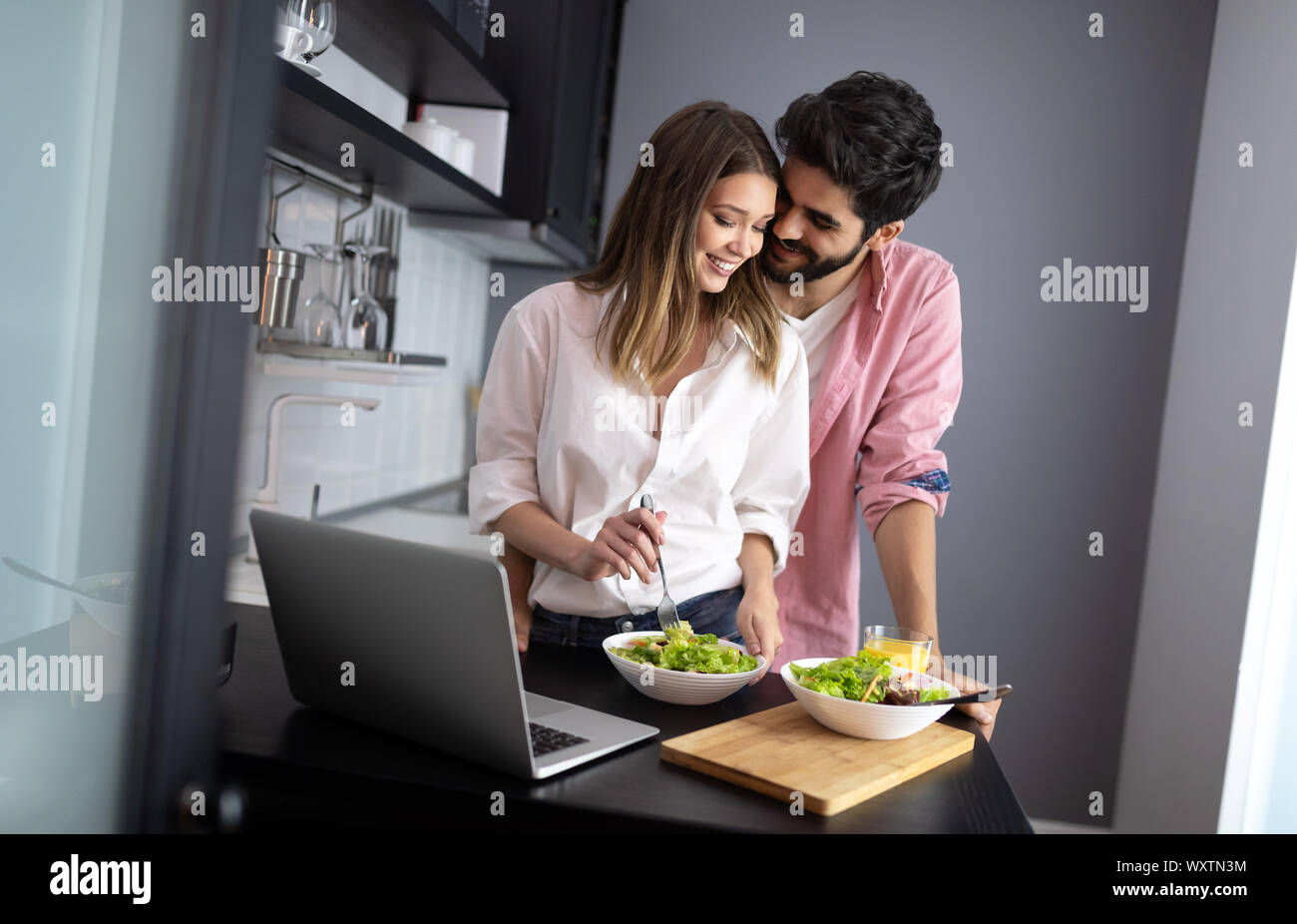 Couple enjoying breakfast time together at home. Stock Photo