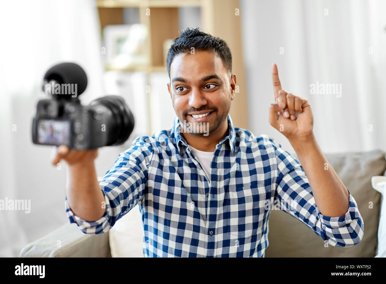blogging, videoblog and people concept - smiling indian male video ...