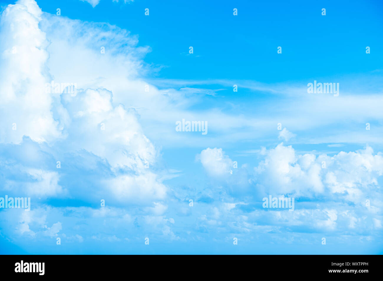 White clouds in blue sky, abstract blurred background Stock Photo - Alamy