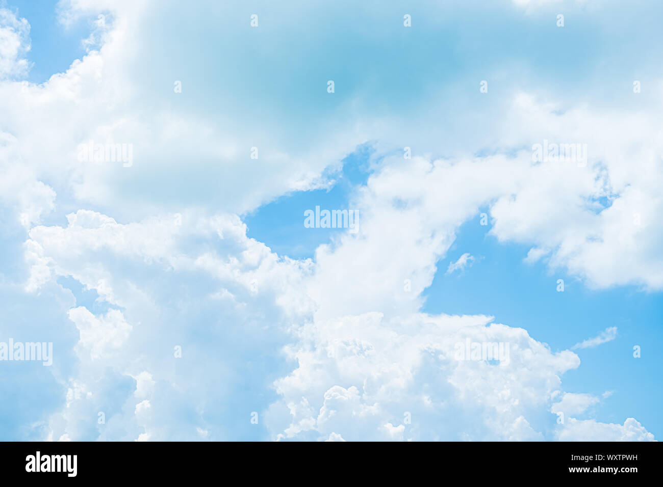 White clouds in blue sky, abstract blurred background. Stock Photo