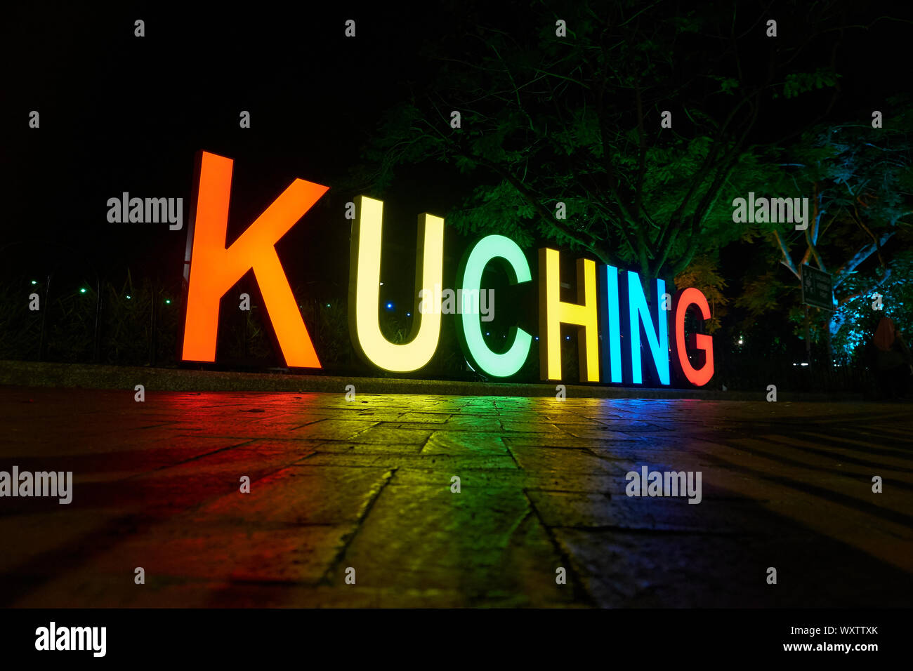 A big, illumunated city of Kuching sign is located on the riverfront promendae. In Kuching, Sarawak, Borneo, Malaysia. Stock Photo
