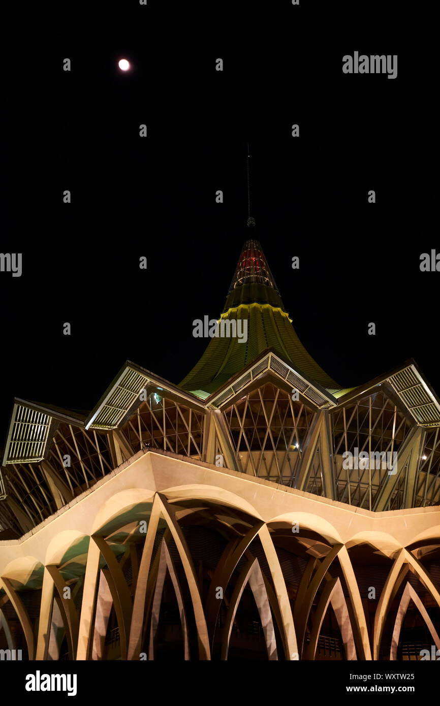 A close up, abstract, graphic look at the Legislative Sarawak State Assembly building during a full moon.  In Kuching, Sarawak, Borneo, Malaysia. Stock Photo