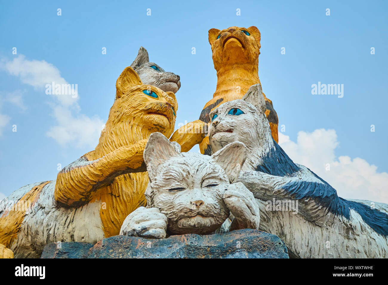 A statue of a group of cats, the symbol of Kuching (cat in Malay), in