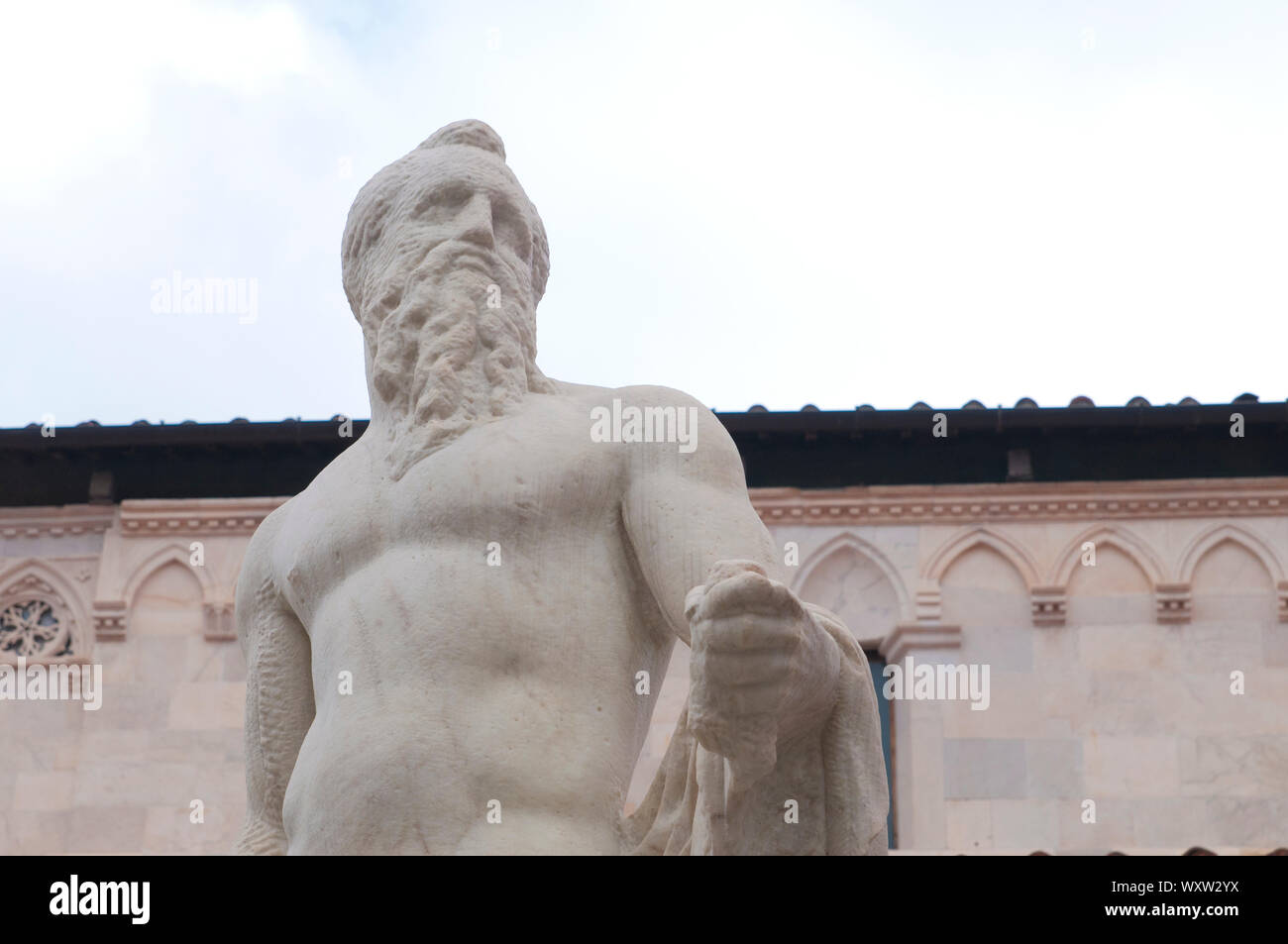 Carrara, closeup detail of the Neptune sculpture in Duomo square made