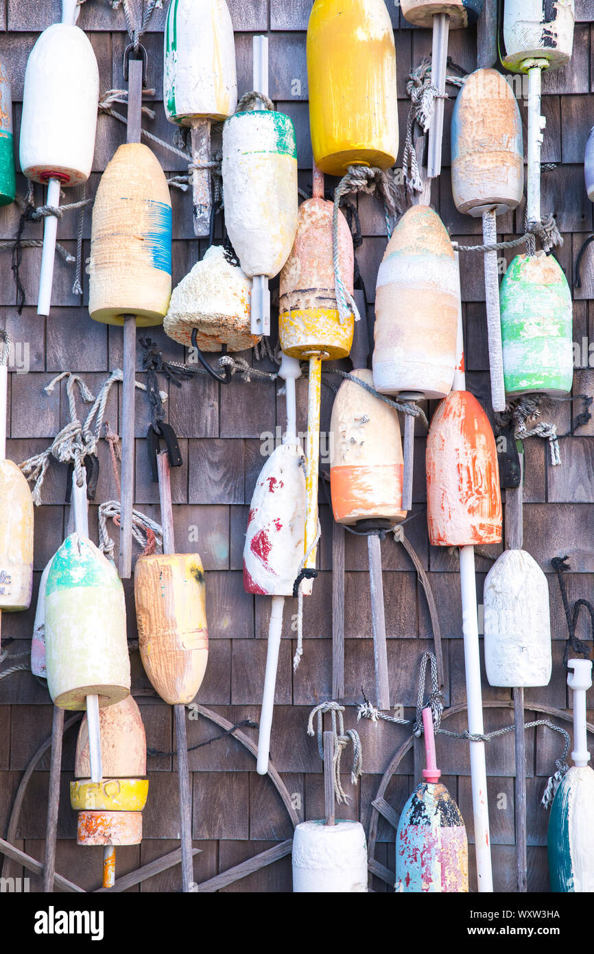 Colourful lobster buoys on oak shingle at Captain Cass - Cap't Cass Rock Harbor Seafood Cafe at Orleans, Cape Cod, New England, USA Stock Photo