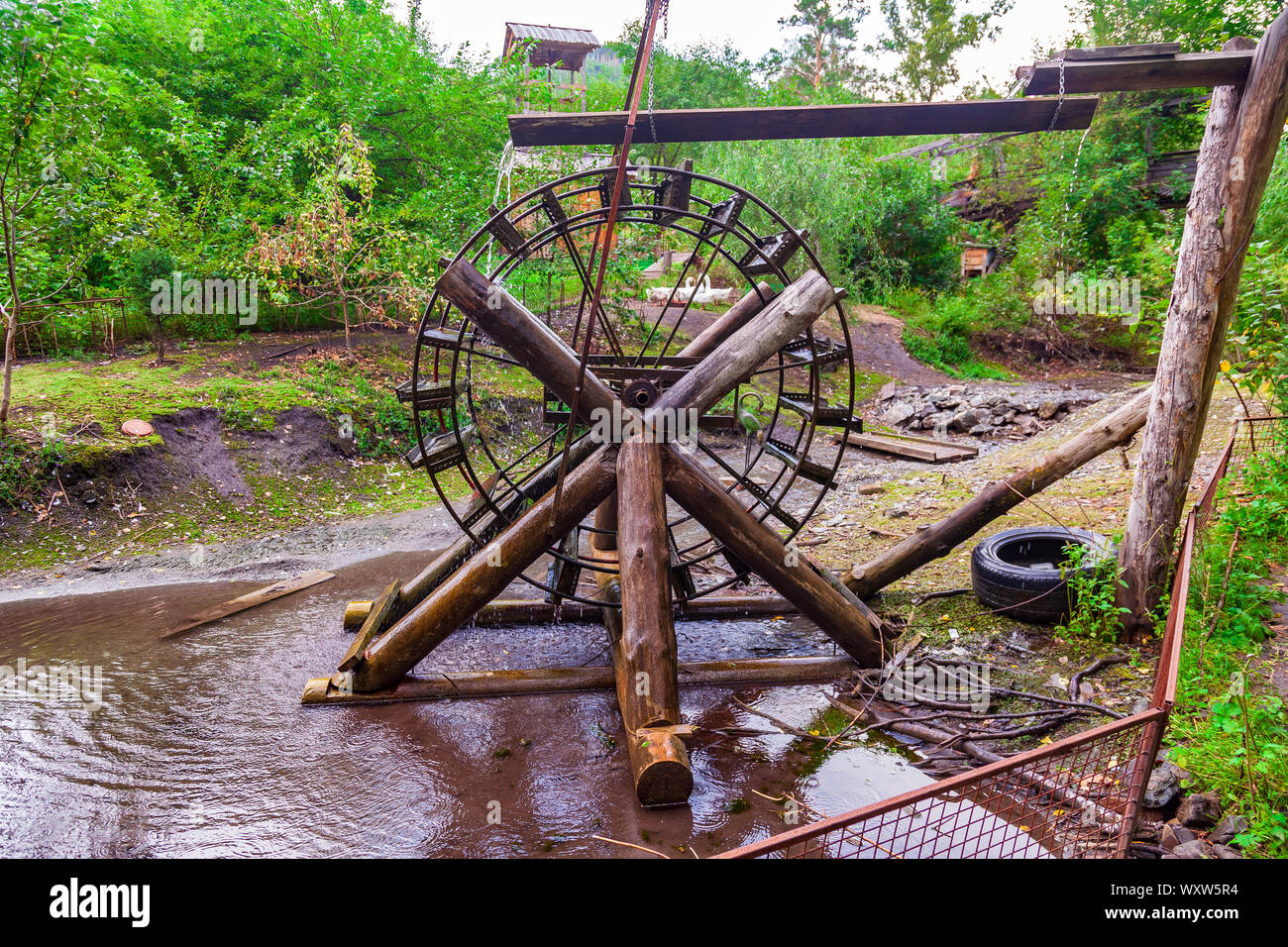 Old retro water mill for generating electricity from natural sources