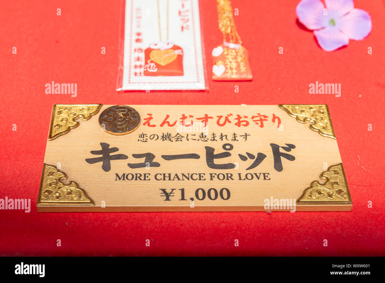 'More chance for love – ¥1,000', Japanese lucky charm (yakuyoke) Stock Photo
