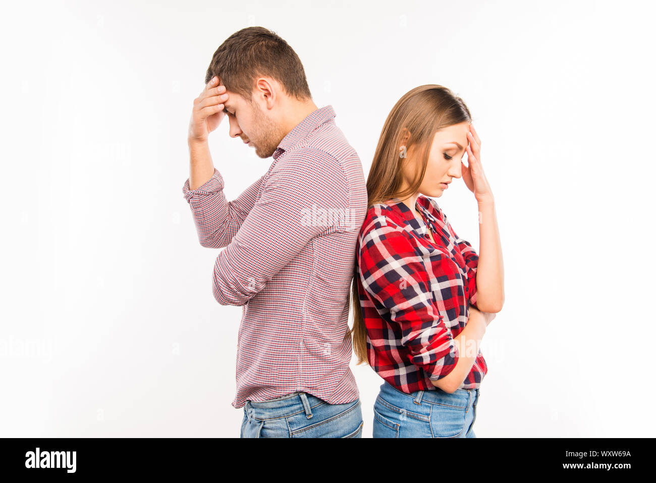 Ignoring Back Couple in love standing back to back ignoring each other Stock Photo ...