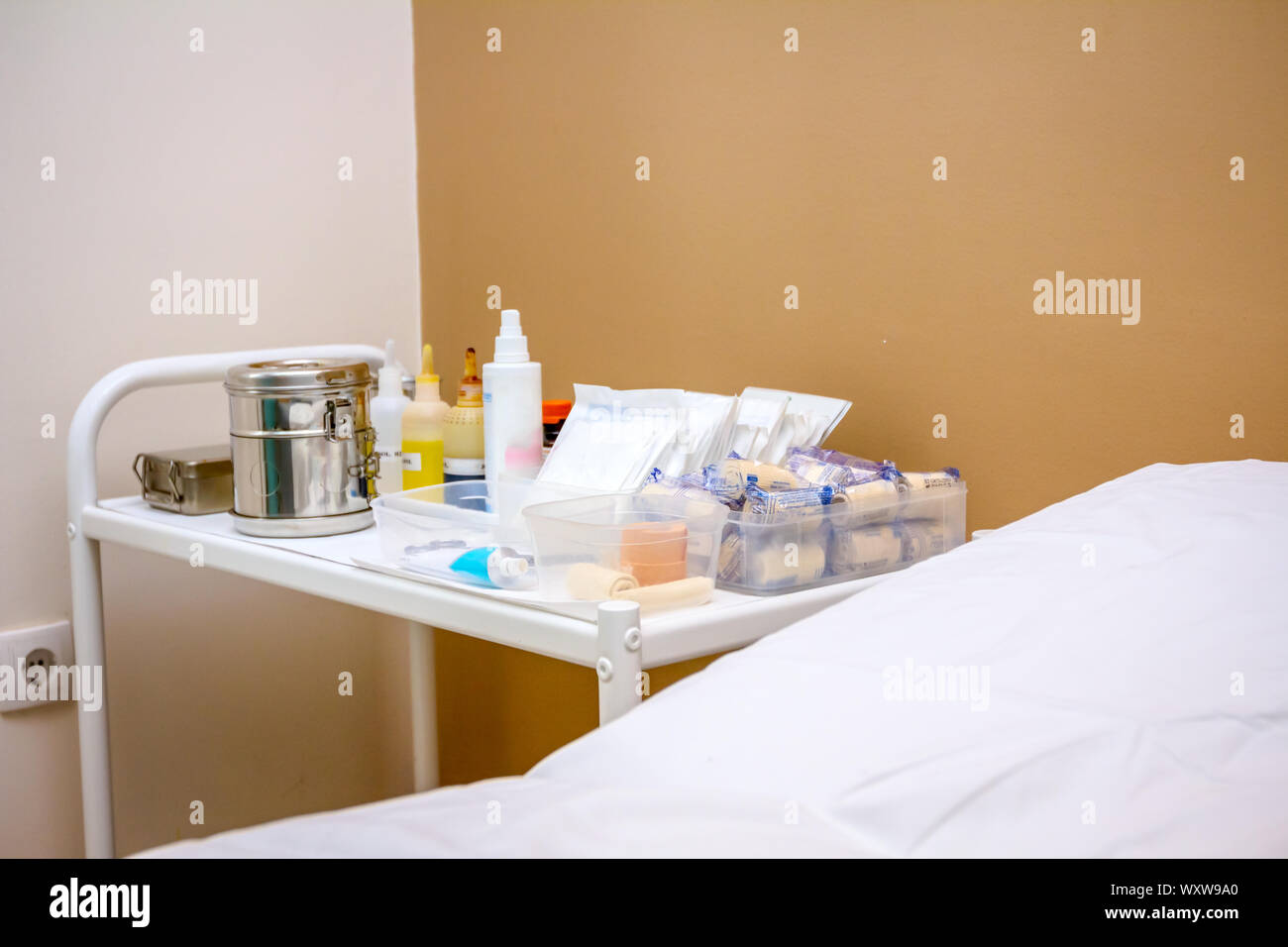 Doctor's table with medical equipment for first aid placed next to the ...