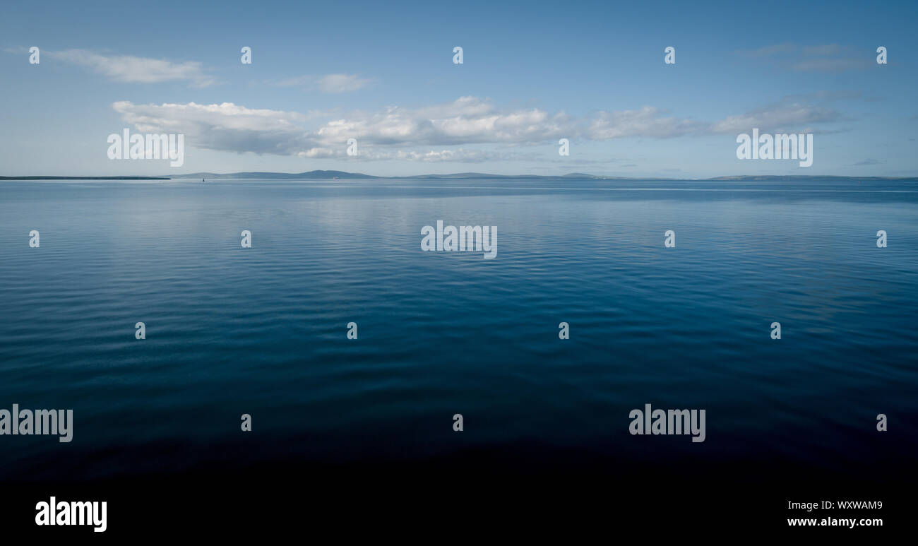 View of Scapa Flow in Orkney, Scotland on a calm sunny day Stock Photo