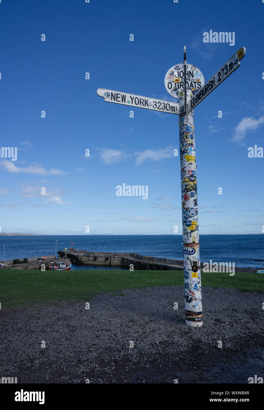 The famous signpost at John o'Groats, Scotland showing distances to New York and Edinburgh Stock Photo
