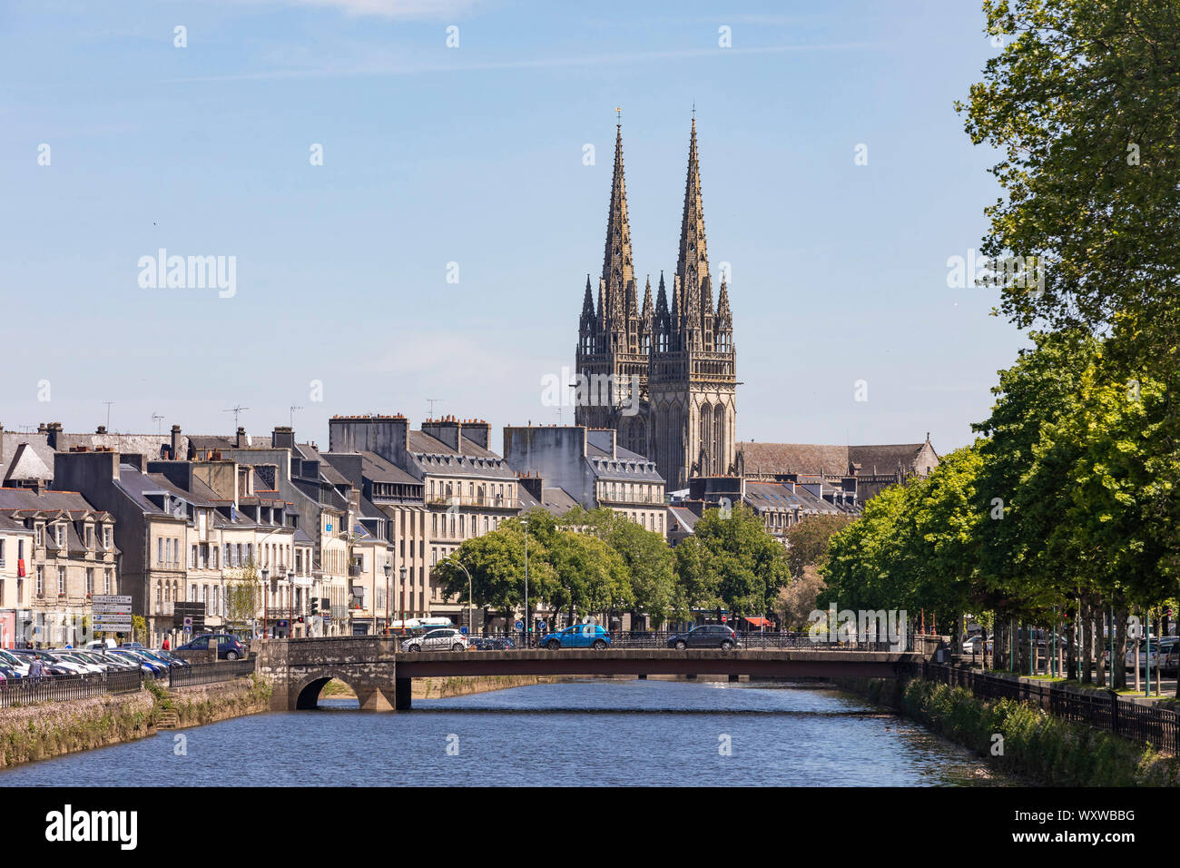 Quimper (Brittany, north-western France): overview of the town centre from the Odet river. The Odet river, the city centre and spires of the Cathedral Stock Photo