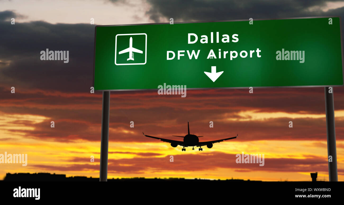 Airplane silhouette landing in Dallas DFW, Texas, USA, America. City arrival with airport direction signboard and sunset in background. Trip and trans Stock Photo