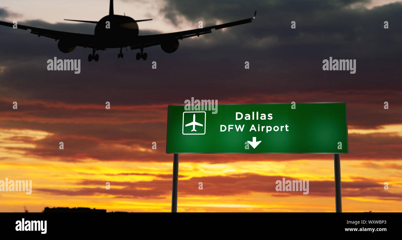 Airplane silhouette landing in Dallas DFW, Texas, USA, America. City arrival with airport direction signboard and sunset in background. Trip and trans Stock Photo