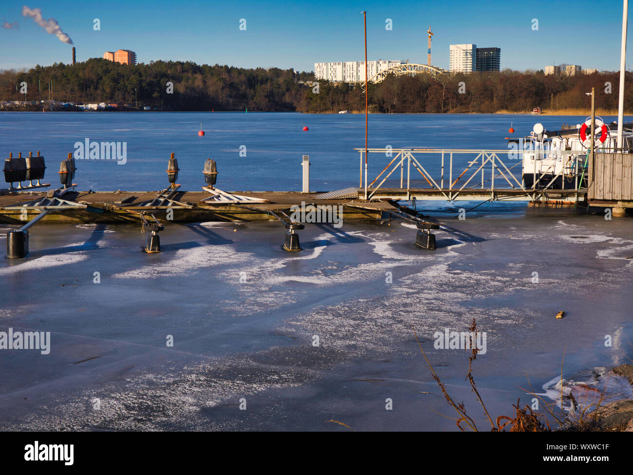 Boat moorings frozen in ice, Arstaviken, Stockholm, Sweden Stock Photo